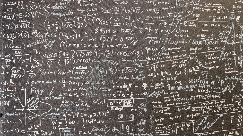 Blackboard full of equations.